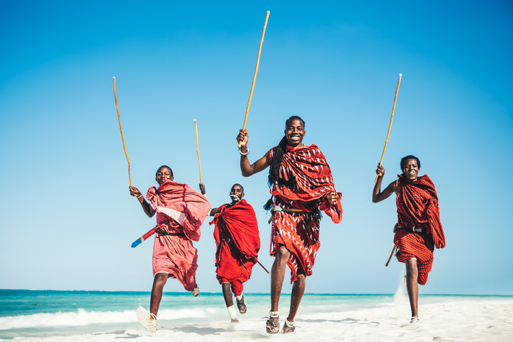 Masai People Running On The Beach