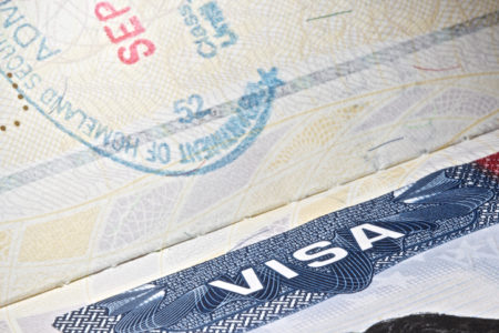 Detail of an USA VISA plus a partial stamp