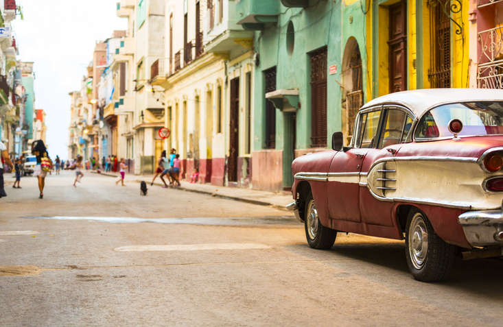 classic car on colorful street in Cuba