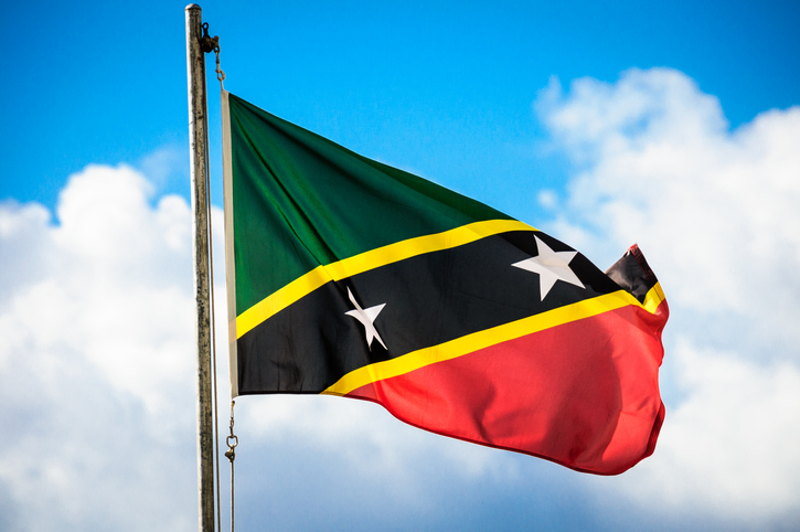 The National flag of St. Kitts and Nevis flies proudly over the Port Zante cruise ship welcome center.