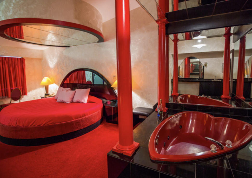 Manhattan Style Suite with red interior and red heart tub inside Feather Nest Inn.