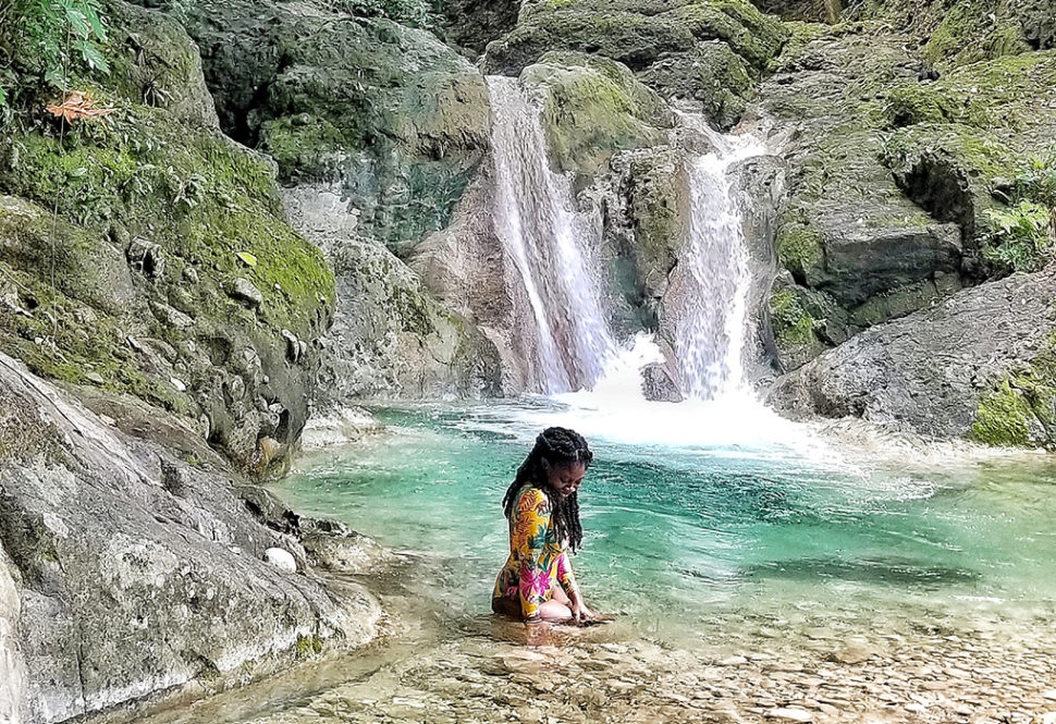 Doreen at waterfall in Jamaica.
