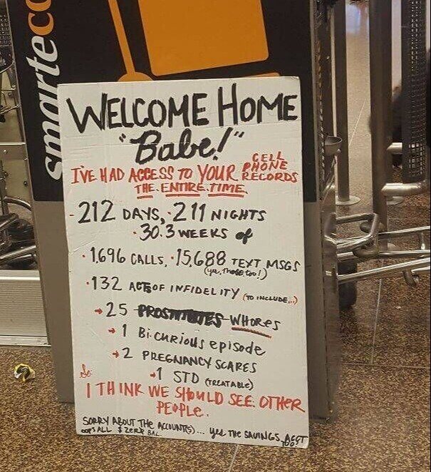 welcome home babe sign freestanding in the airport