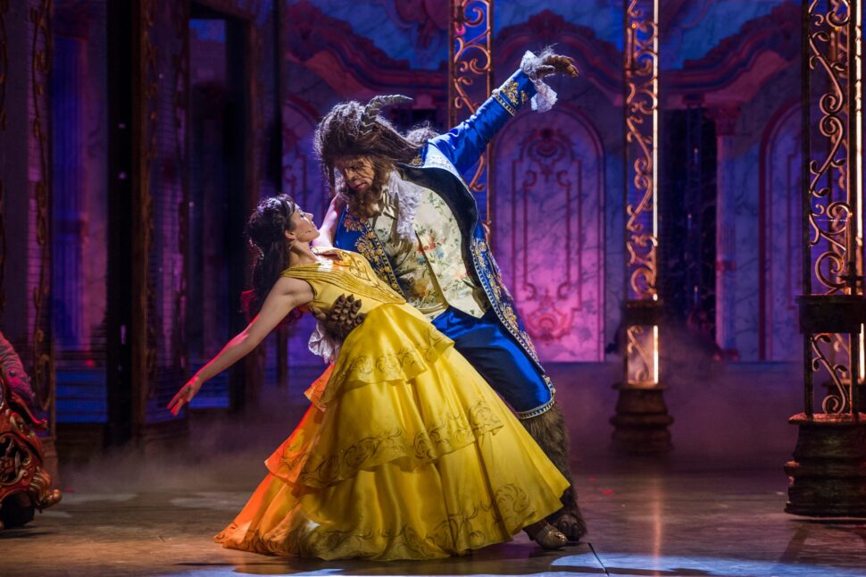 Woman and man performing in Beauty and the Beast on a Disney Cruise