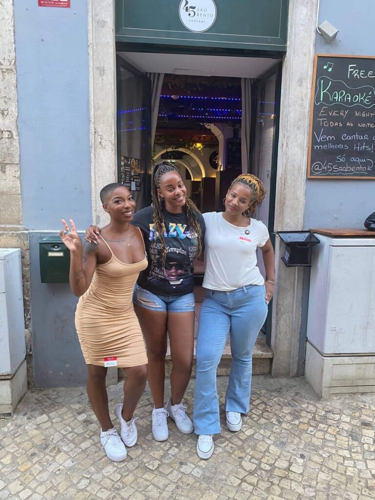 Black Women Expats standing in front of a store In Portugal