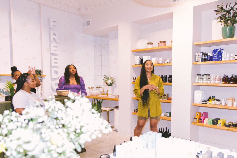 women standing inside retail store freedom apothecary