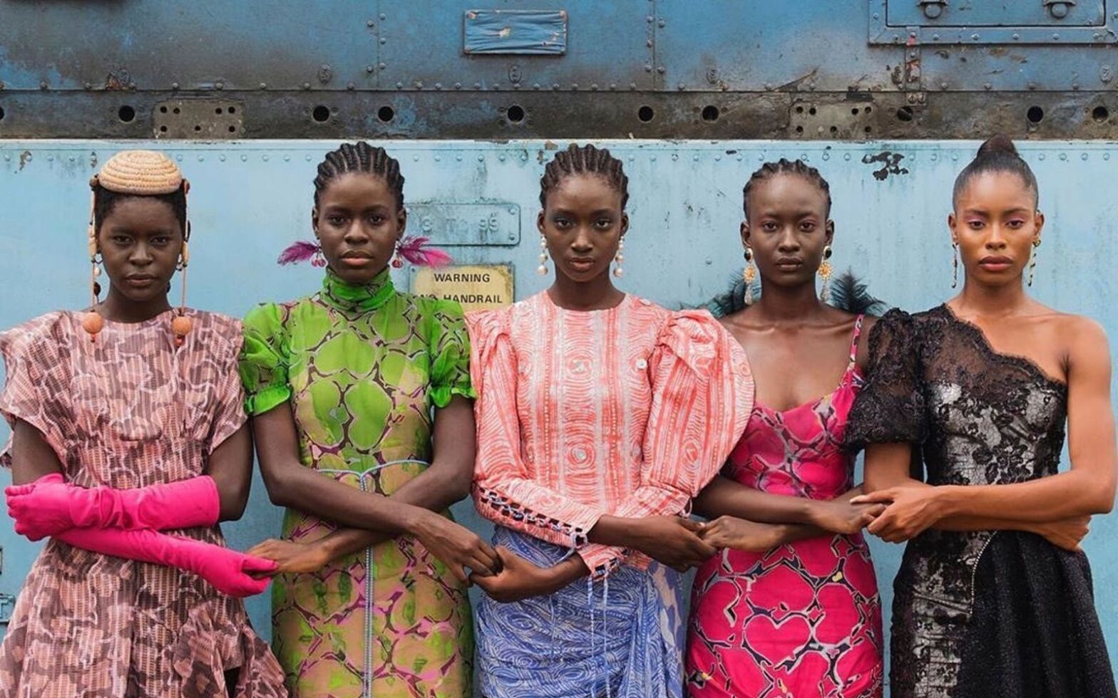Models holding hands, Lagos, Nigeria, 2019 - African Fashion Exhibit at Brooklyn Museum