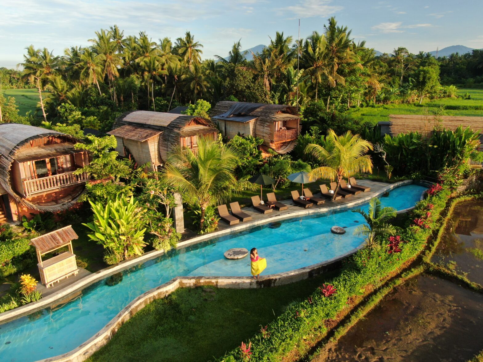 The outside exterior of the Beehouse Dijiwa in Ubud, Bali with the lagoon pool.