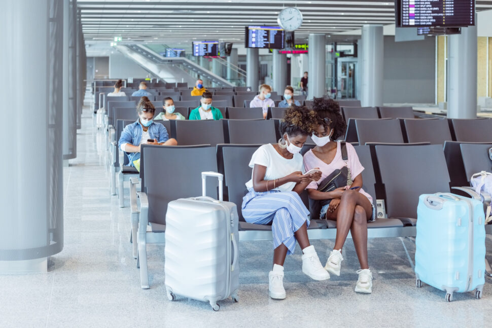 is turkey safe to travel?
pictured: two Black women wearing masks in an airport
