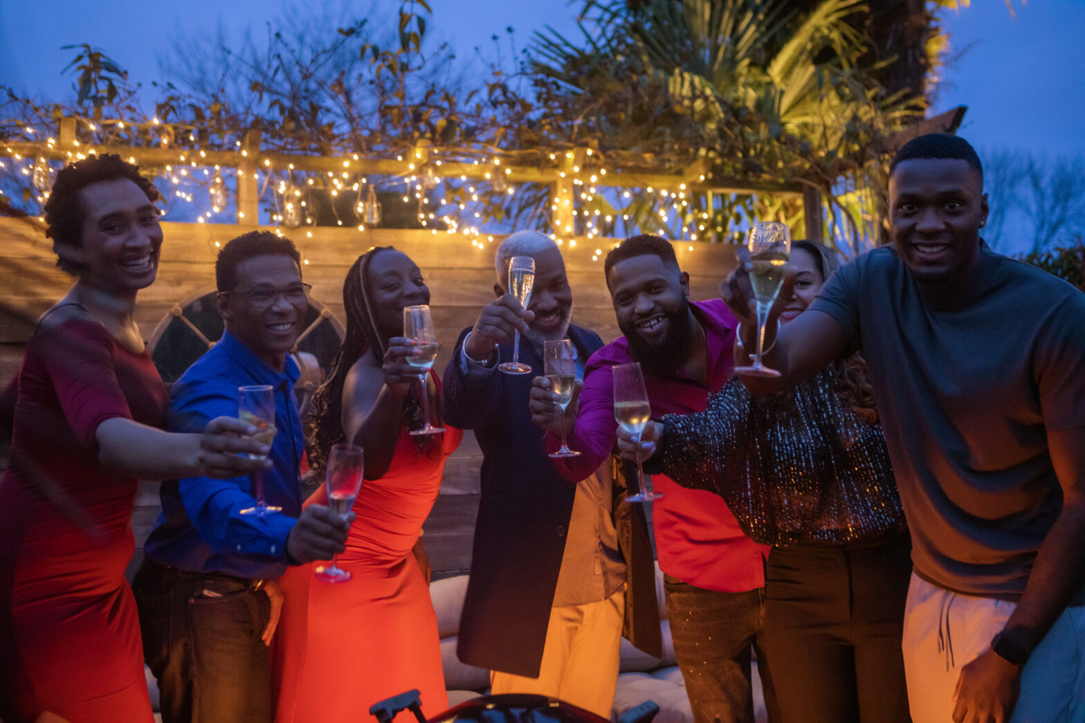 Black friends toasting at an outdoor celebration - Juneteenth 2023 Events