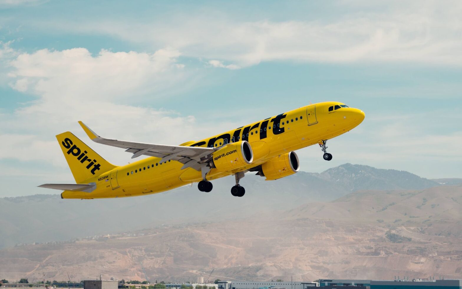 Spirit airlines plane taking off - company introduces new AI tech to improve flight schedules