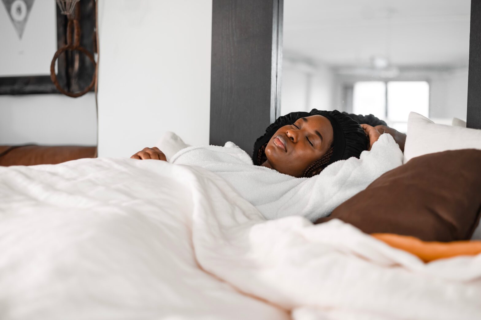 woman sleeping in bed - sleep tourism on the rise