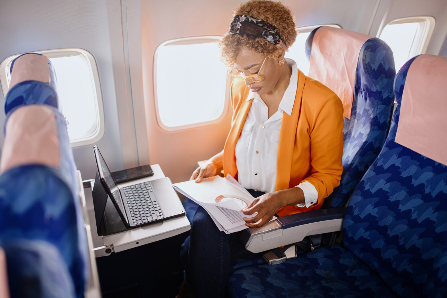 Businesswoman working on laptop during flight