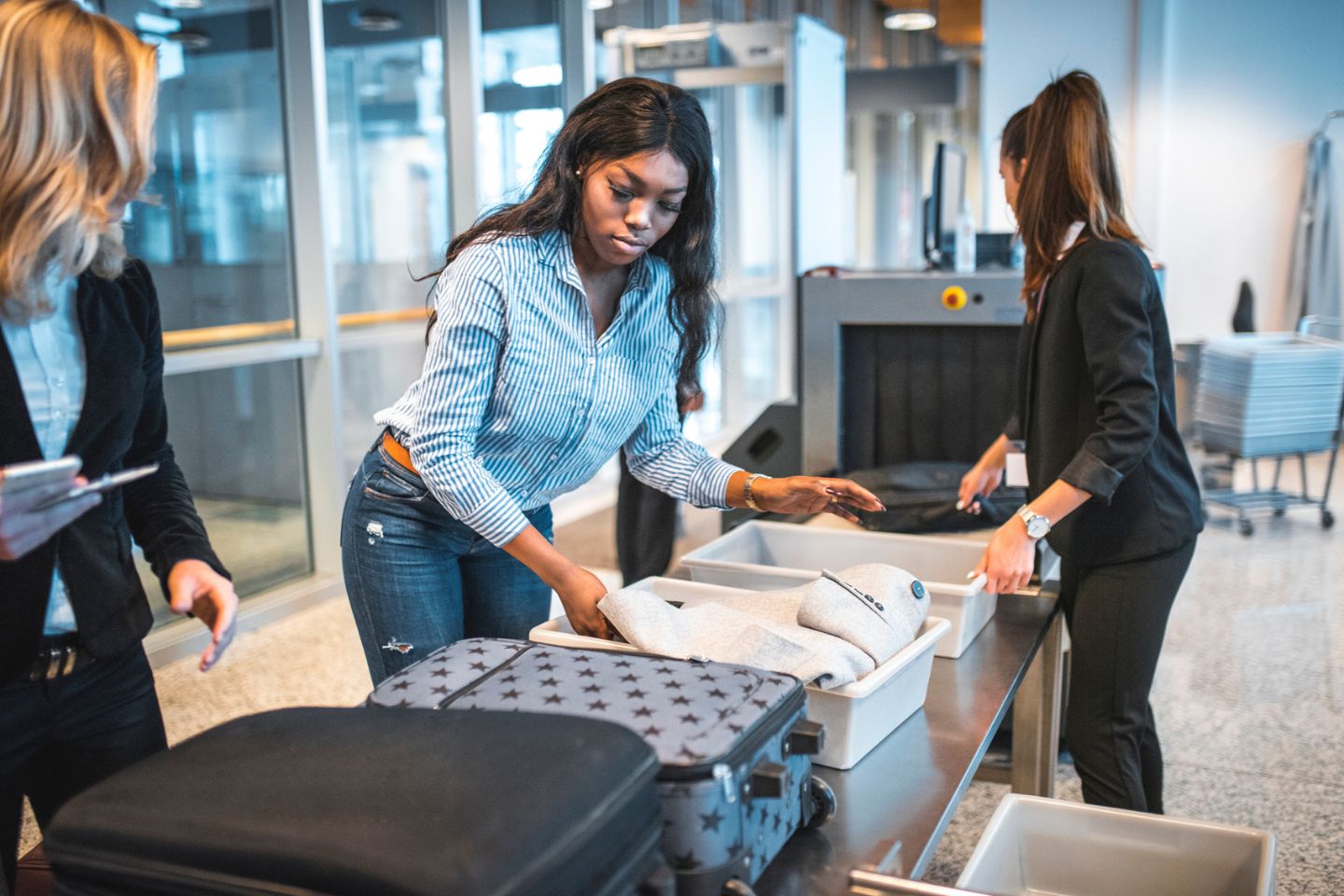 woman going through airport security screening