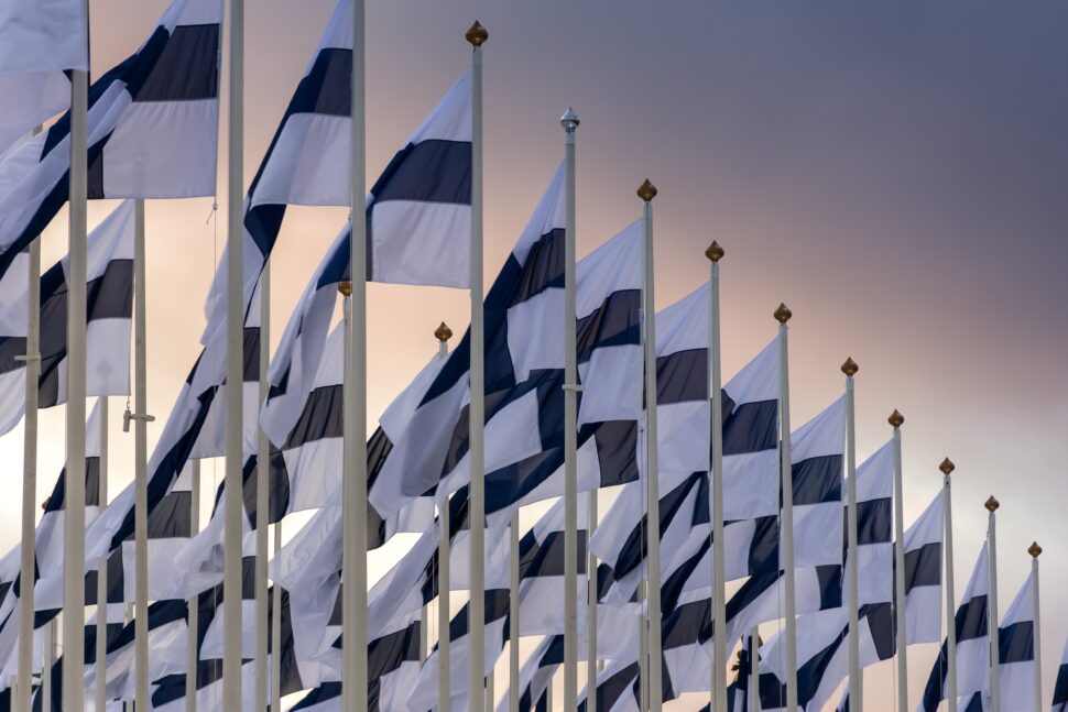 Finland flags waving in the air