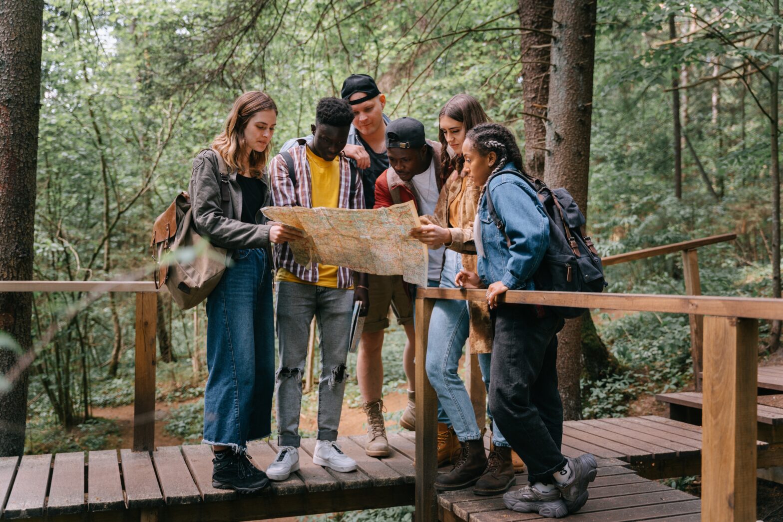 group of people looking at map - hiking near nyc