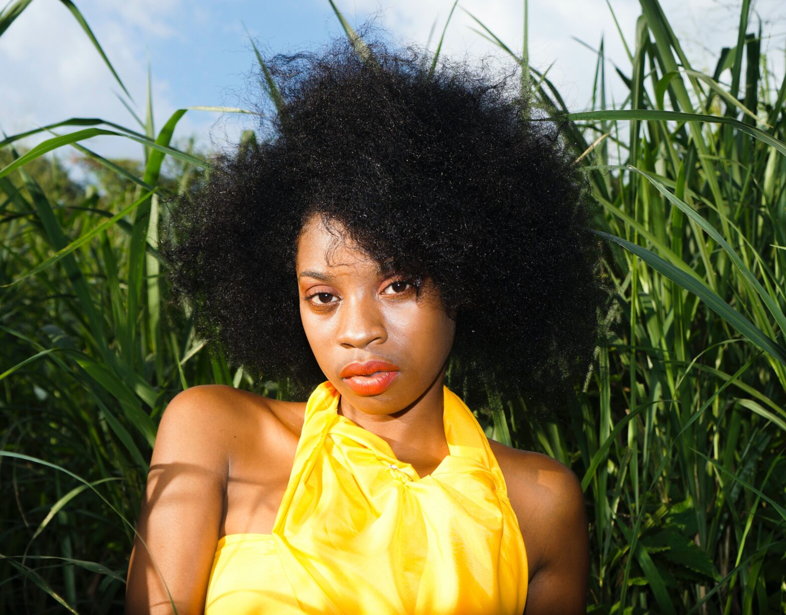 woman with natural hair outside - CURLFEST 2023