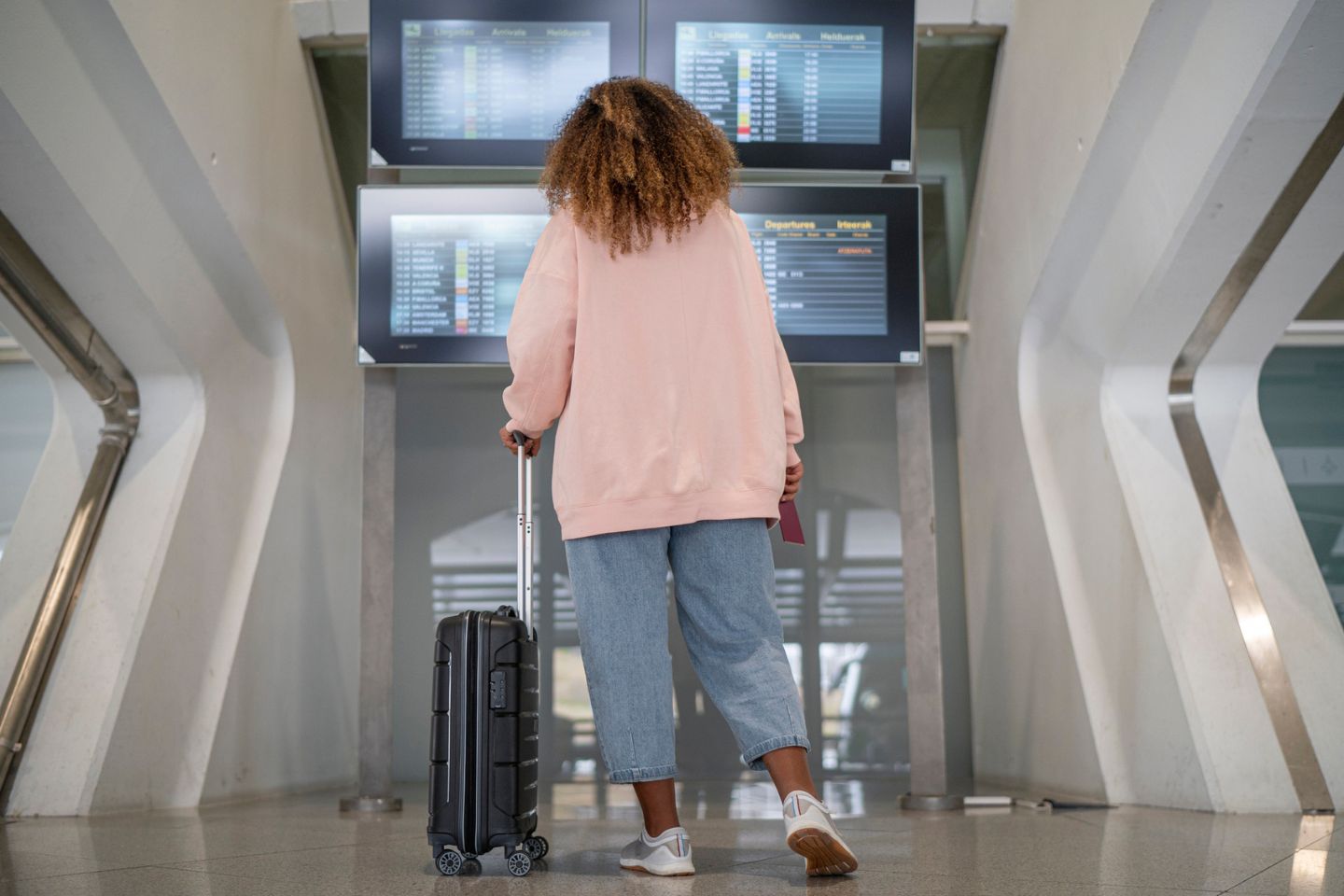 Black Woman in Cozy Sweater at Airport