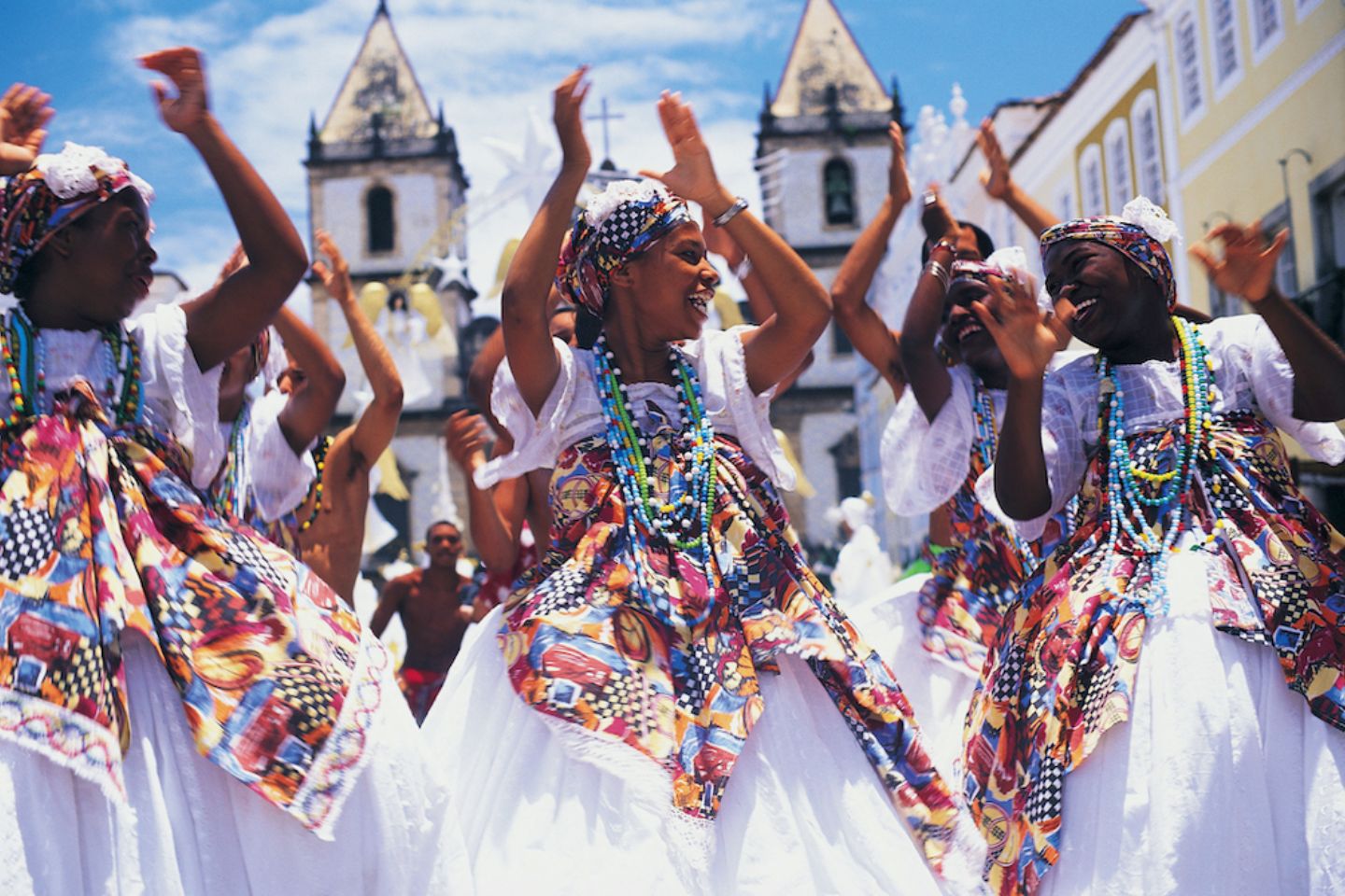 Brazil, Salvador, female dancers in street clapping