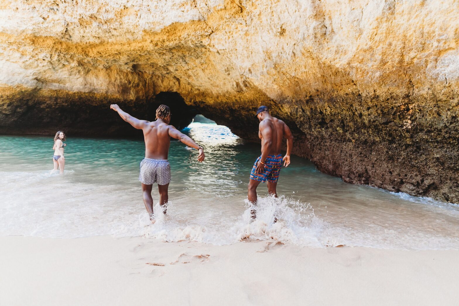 males playing on the beach