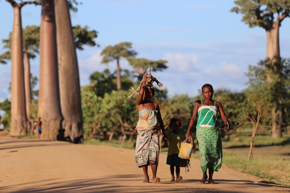 women and child walking in Madagascar