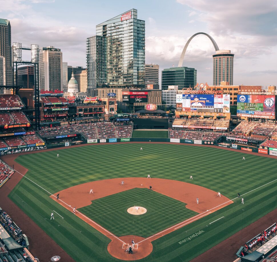 Sports are popular in St. Louis, mostly due to the St. Louis Cardinals and other sports destinations within the city. Pictured: baseball field with St. Louis in the background 