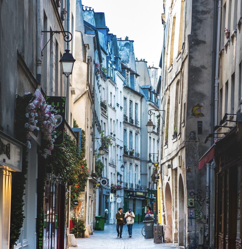 Check out the popular tourist districts in Paris that offer the most to visitors. Learn what the best arrondissements to stay in are.
Pictured: Le Marais with locals walking throughout the streets during the day