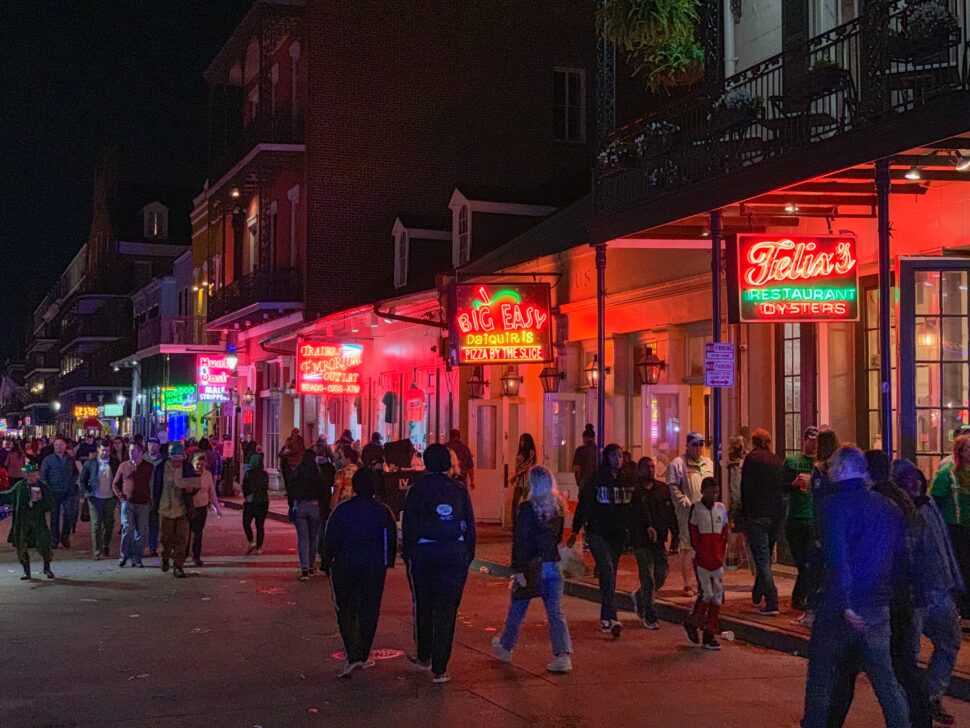 Partying is a popular activity for visitors of New Orleans. But considering the history of the city, it is normal for visitors to wonder if New Orleans safe to visit. Pictured: Bourbon Street in New Orleans bustling with people