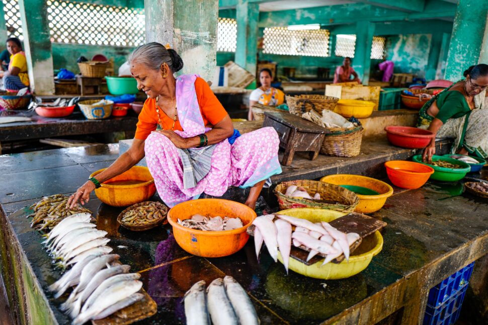 woman with fish at a market