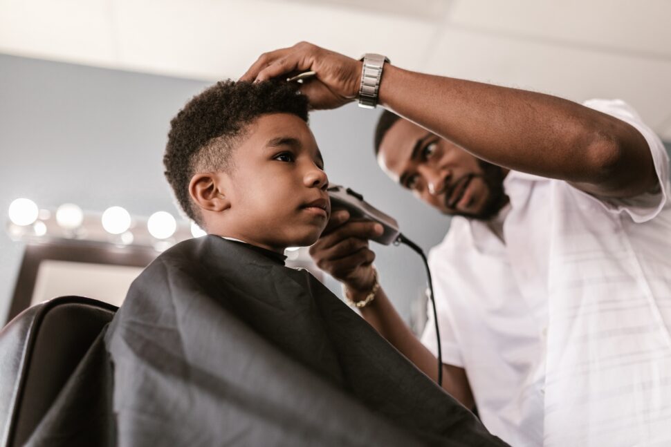 young boy getting haircut
