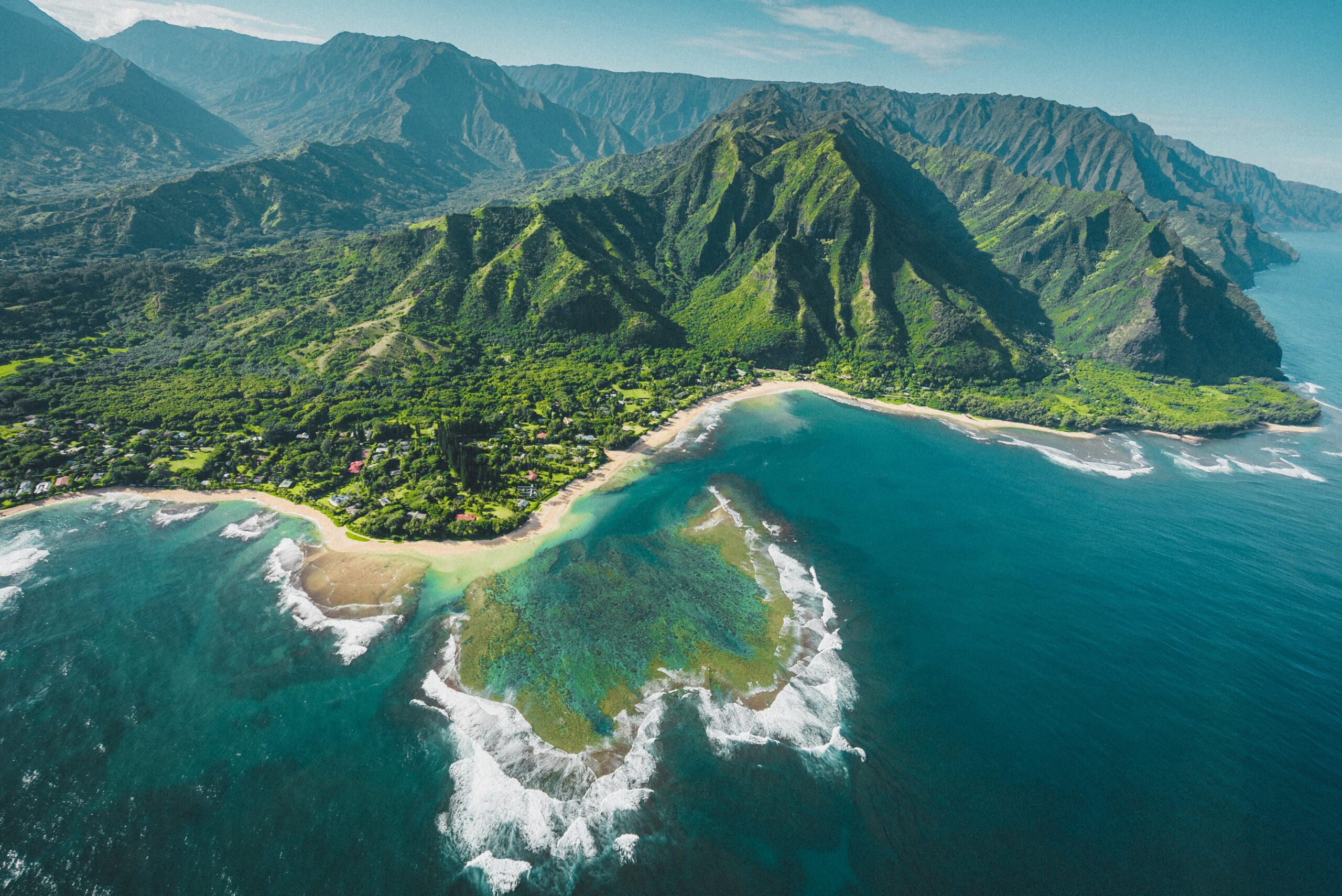 There are many secluded islands in Hawaii that visitors will enjoy. 
Pictured: a rural Hawaiian island with blue waters and green lush mountains