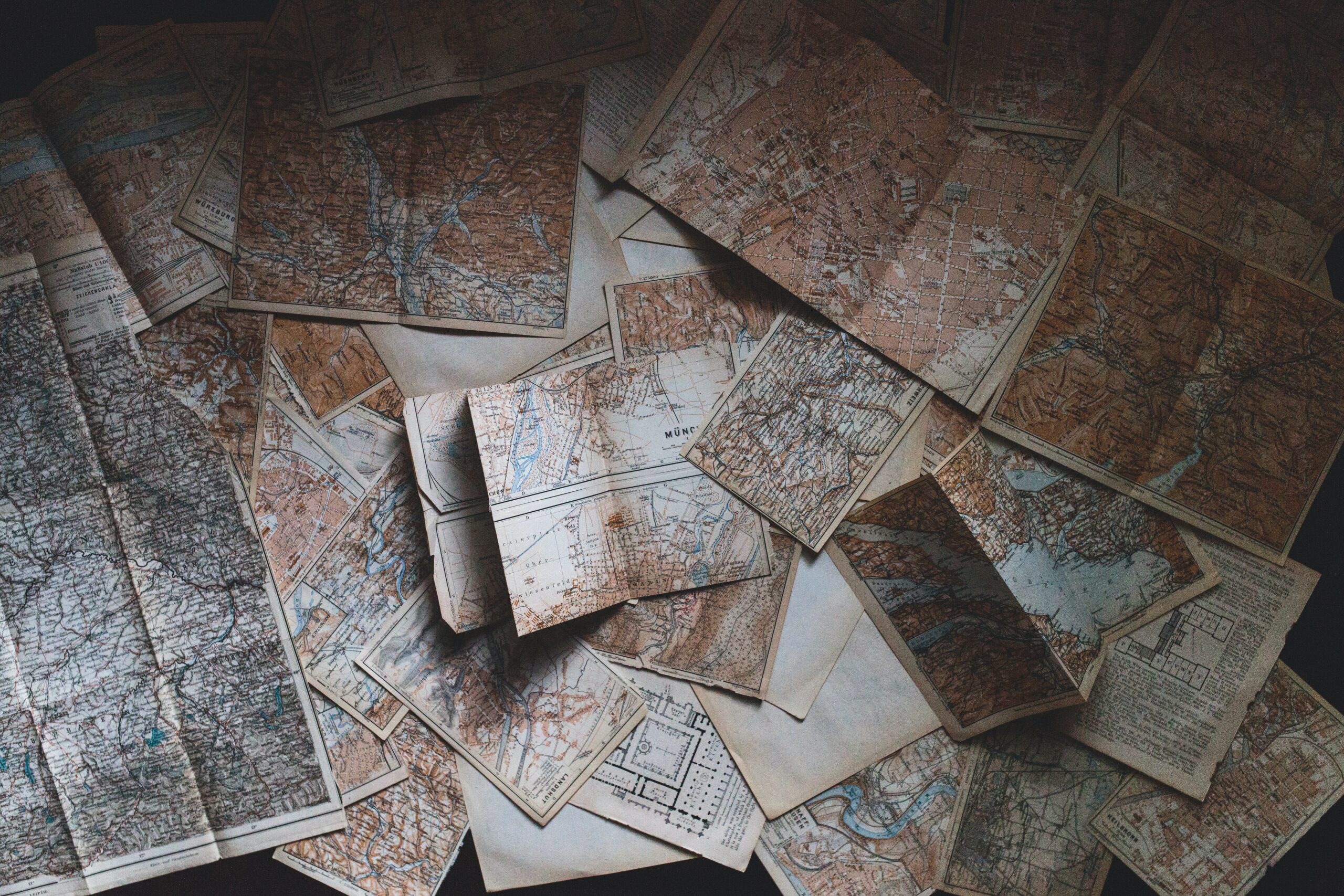 A road trip is a fun and affordable way to travel but can be boring. Learn about these classic and modern games that can help bring fun to the journey. 
pictured: detailed maps traditionally used to navigate road trips 