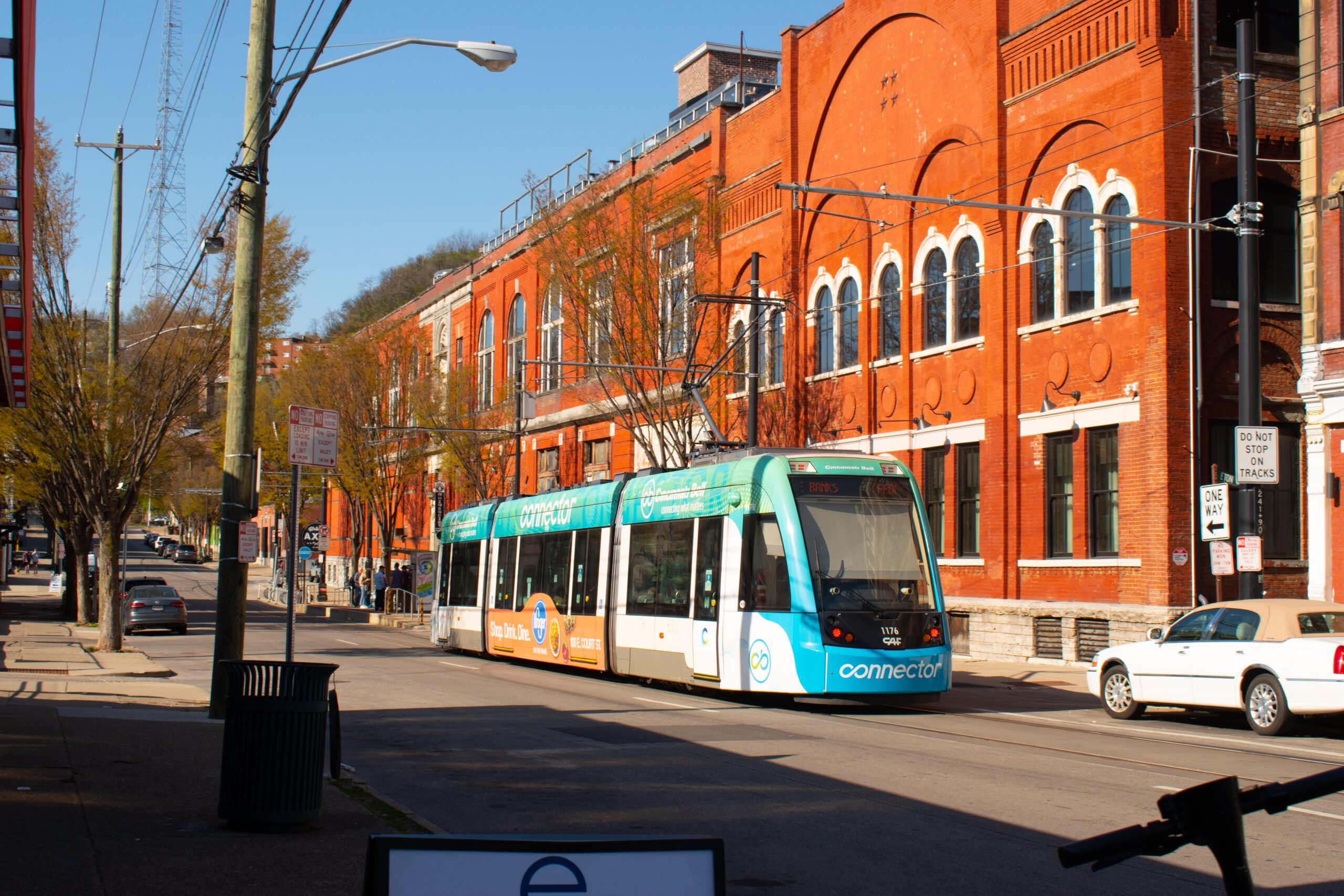 The transportation of Cincinnati is somewhat easy to navigate. Check out the best and safest ways to get around. 
pictured: A Cincinnati street with cars and public buses along the streets during fall