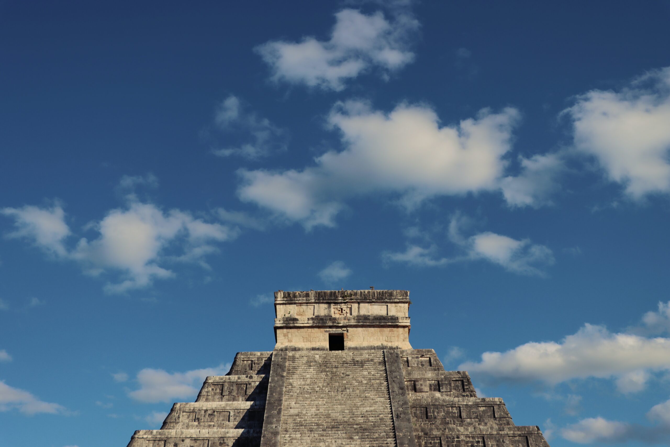 The pyramids of Mexico are vast and provide a deeper look into the history of the country.
pictured: The top of a pyramid in Mexico with a clear blue sky in the background