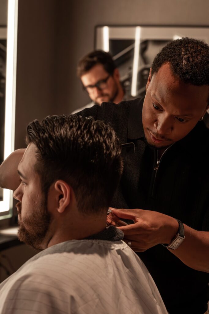 man getting hair cut by barber