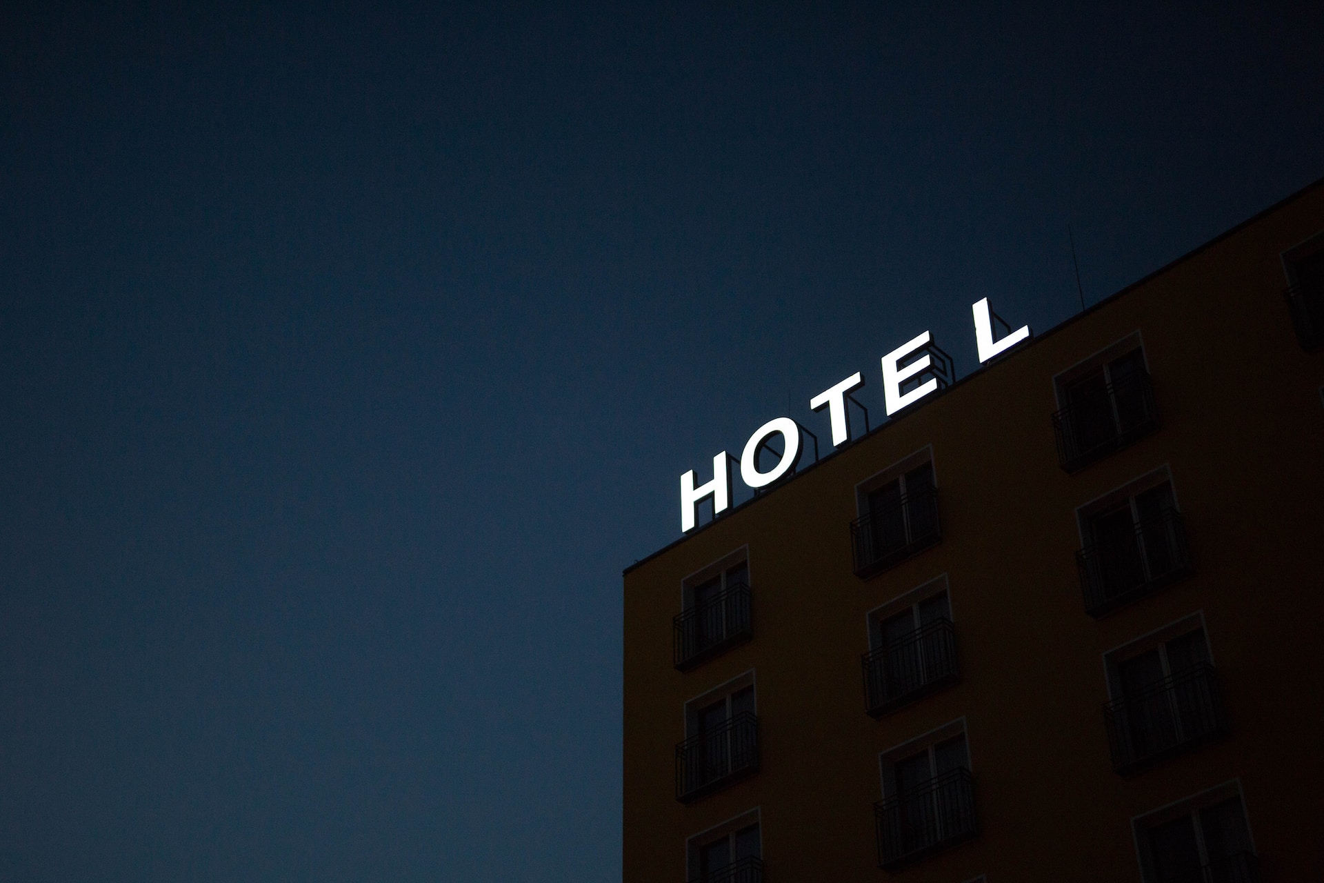 A sign on a building that says 'Hotel"
