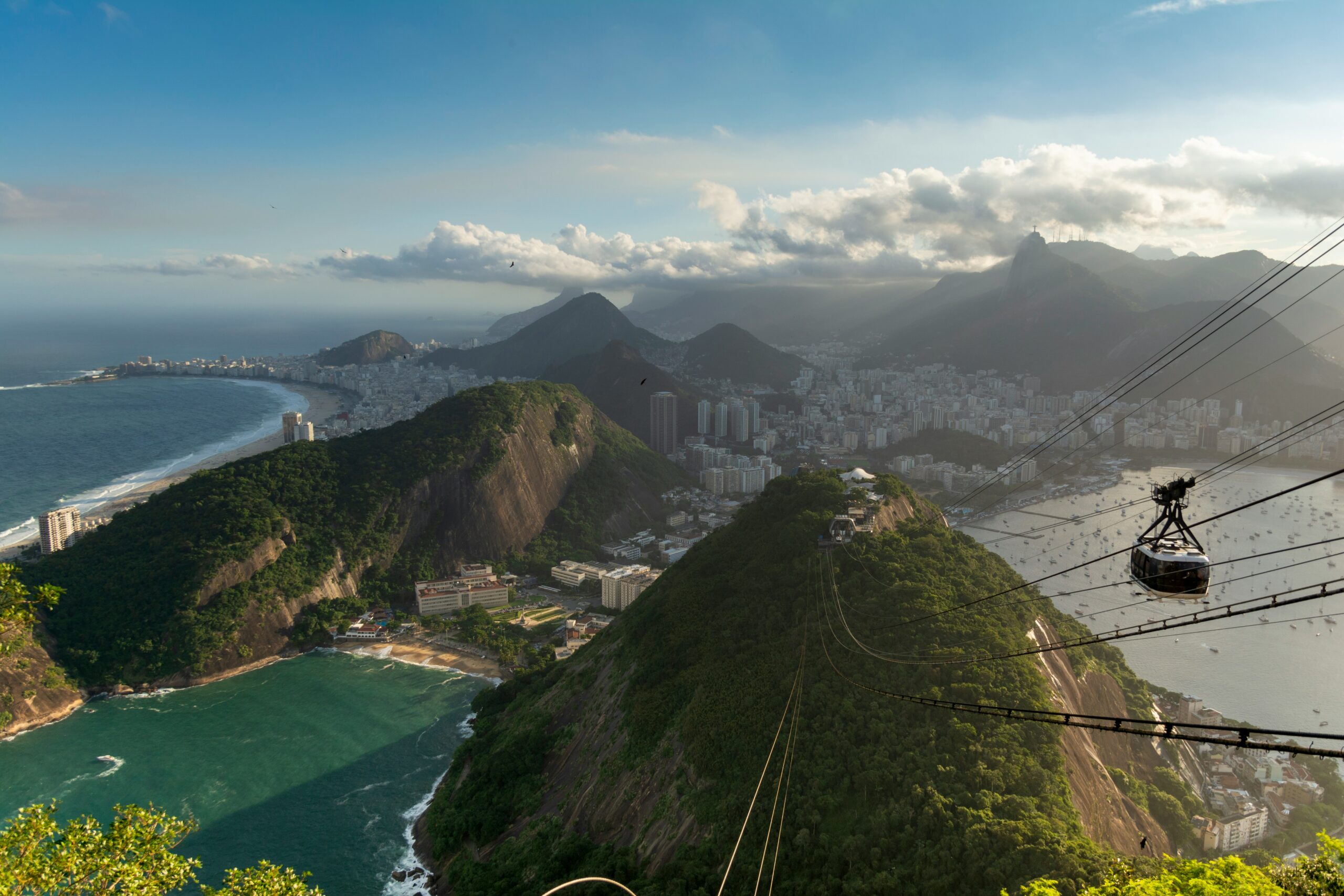 Rio de Janeiro is a pretty safe destination for tourists, but it has its downfalls that travelers should stay aware of.
pictured: Rio's wondrous mountains and cable car system