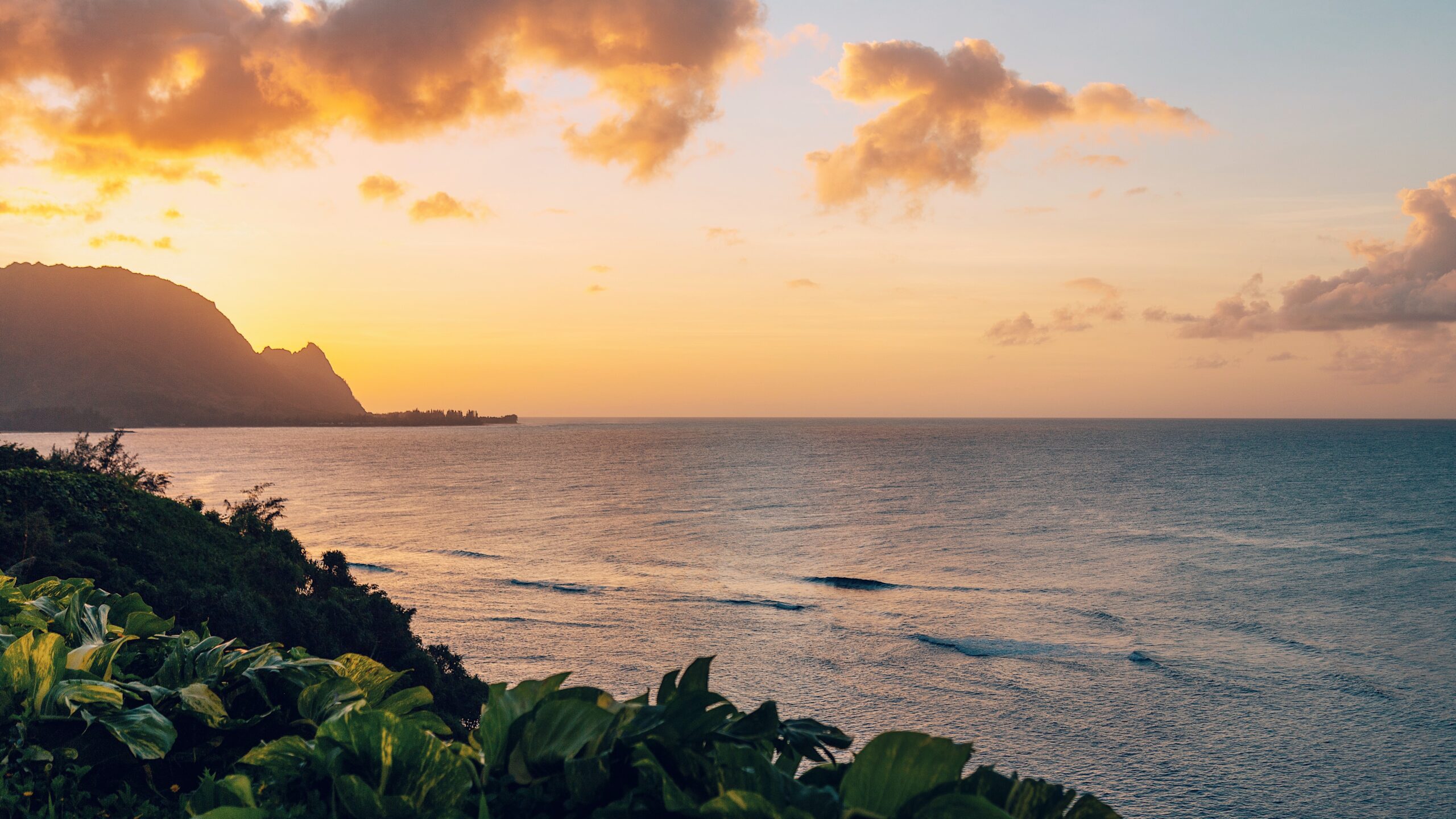 Check out the holiday offerings of the many Hawaiian islands. 
Pictured: the warm sunset off the coast of Kauai 