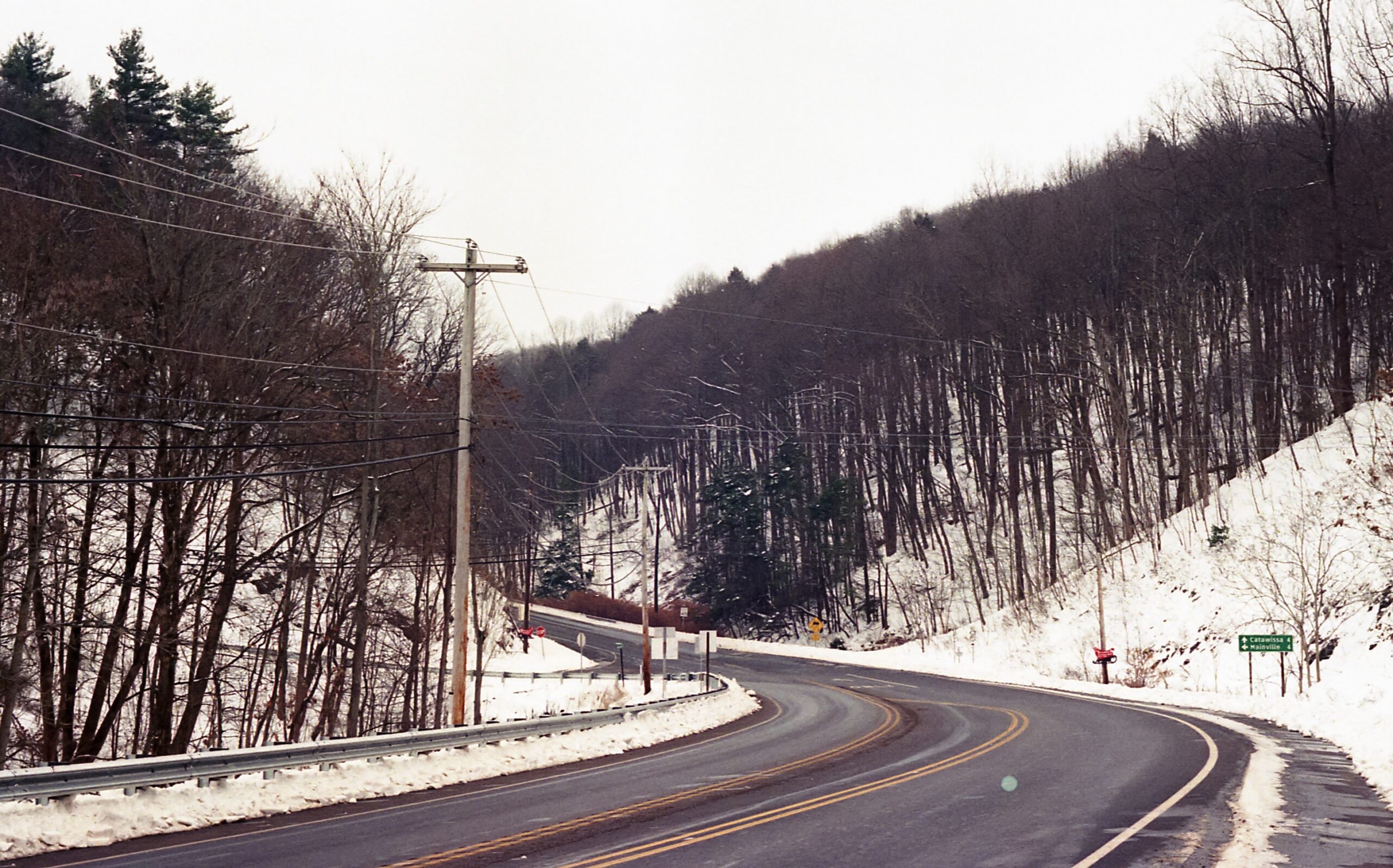 The United States has many destinations which would be ideal for a winter holiday.
Pictured: a snowy winding road in Pennsylvania during the winter 