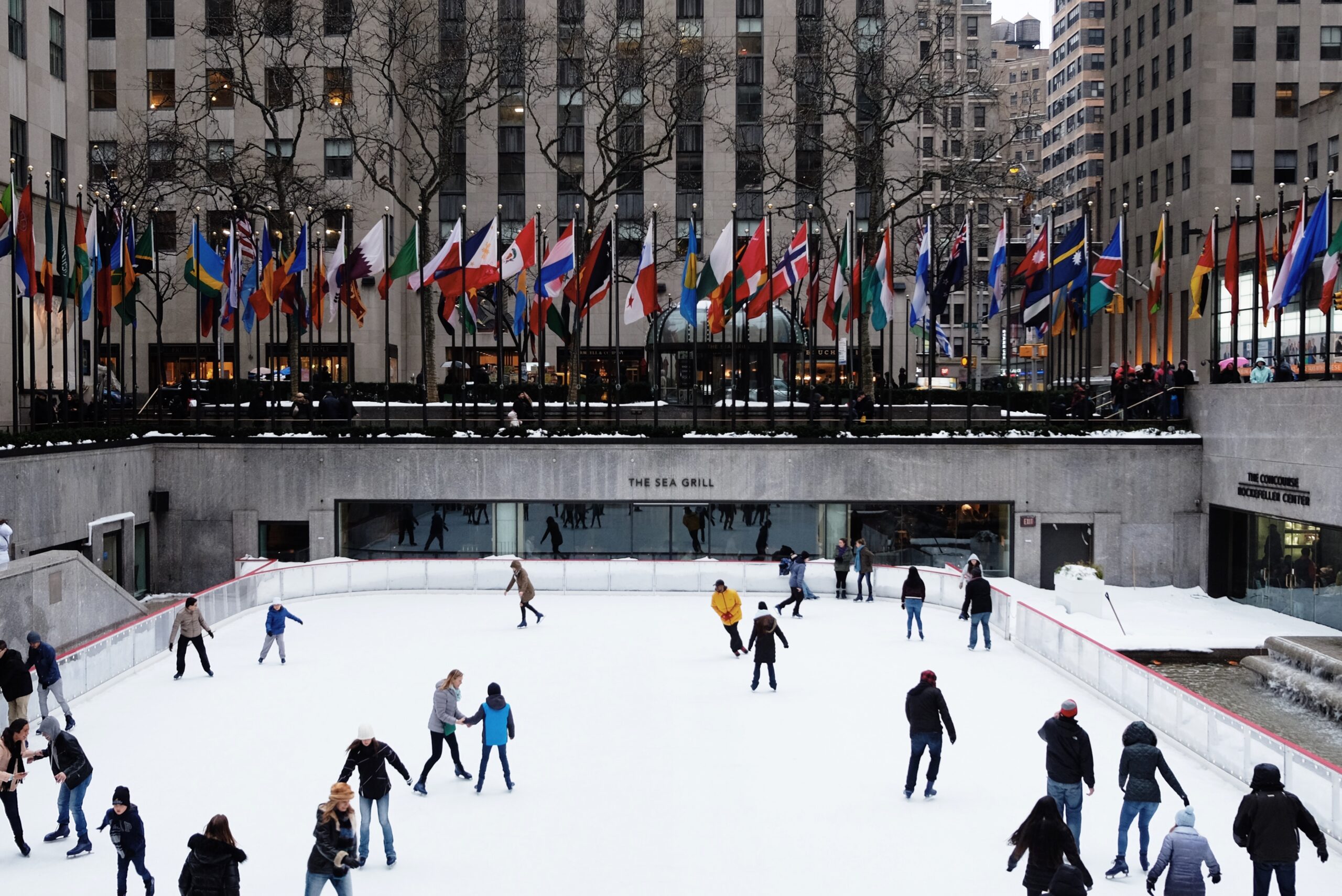 NYC in the winter is almost like another world, check out the Central Park winter activities. 
Pictured: people ice skating at the Rockefeller Center rink 