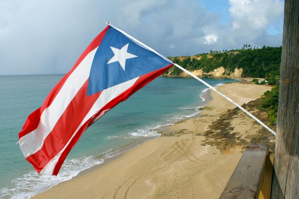 Flag of Puerto Rico over the beach