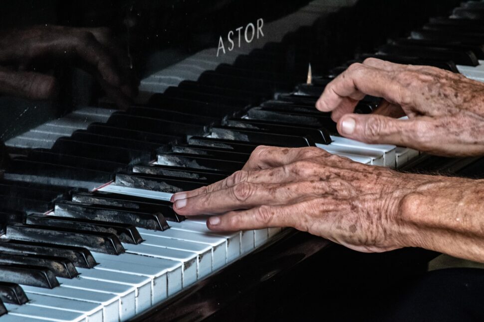 Old hands playing an old Astor in La Habana

