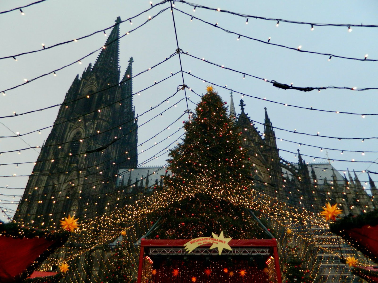 Germany is the Mecca of Christmas markets, visit the European destination that seemingly has it all. 
Pictured: the Christmas market in front of the Cologne Cathedral 