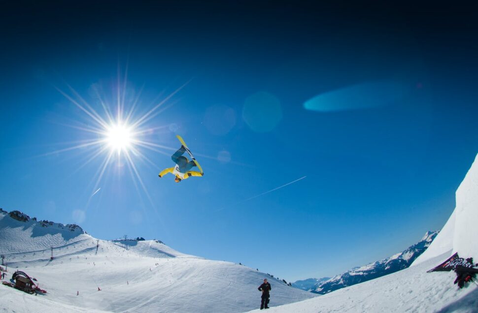 Snowboarding in mid-air. 