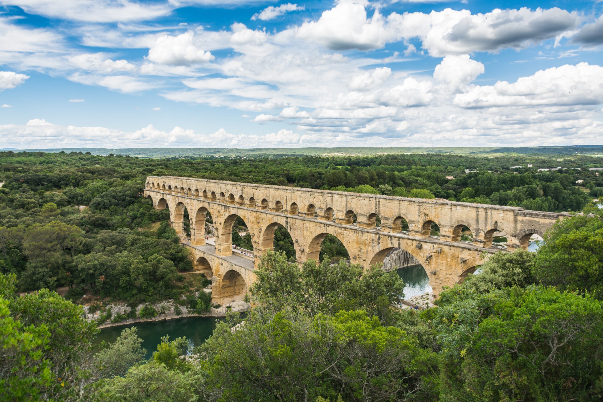 Pont du Gard is an interesting Roman ruin which is located in France. 
pictured: the Pont du Gard Roman bridge 