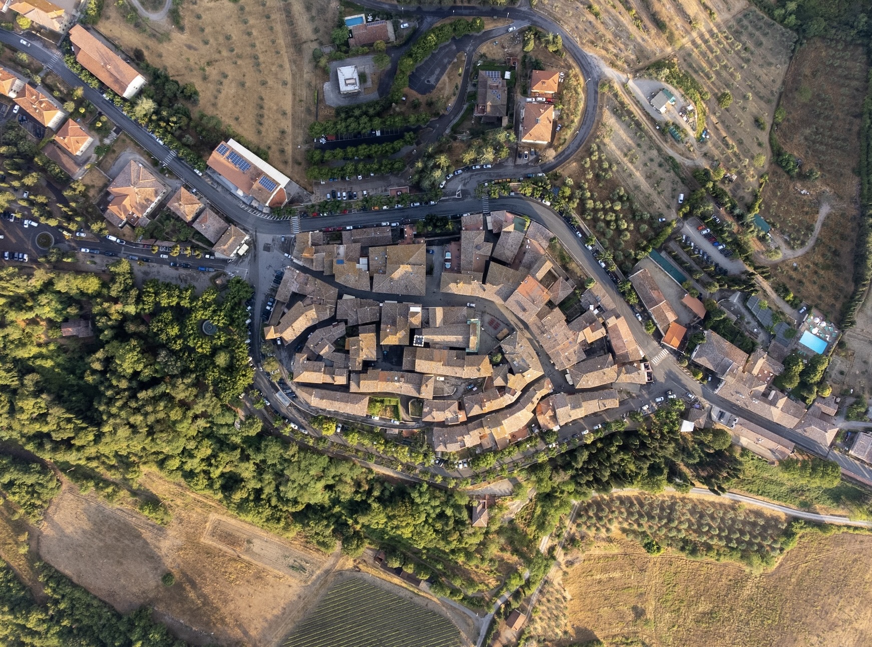 Saturnia is a populated yet quaint location in Italy. it is also home to an ancient hot spring. 
pictured: an overhead look at the village of Saturnia, Italy 