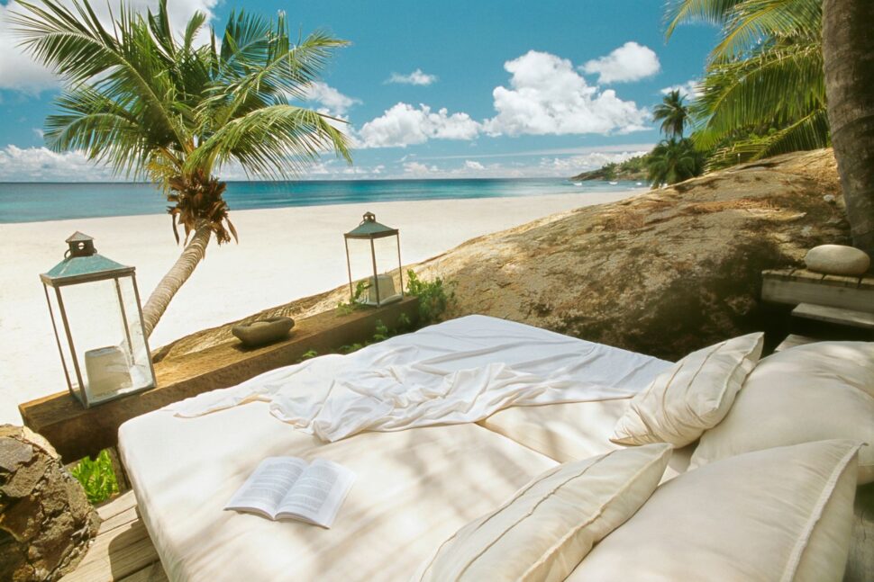 daybed on beach on North Island in Seychelles