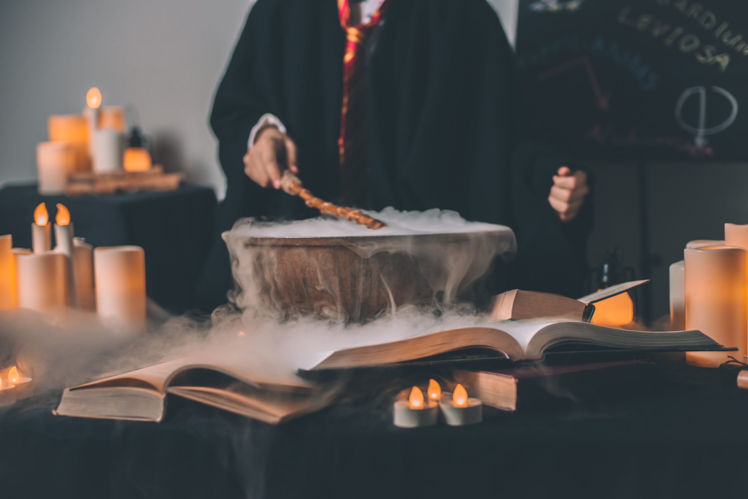 These are the top six Harry Potter themed accommodations from all over the world. 
pictured: an image of a young person holding a wand wearing a Hogwarts robe and doing a spell over a boiling cauldron