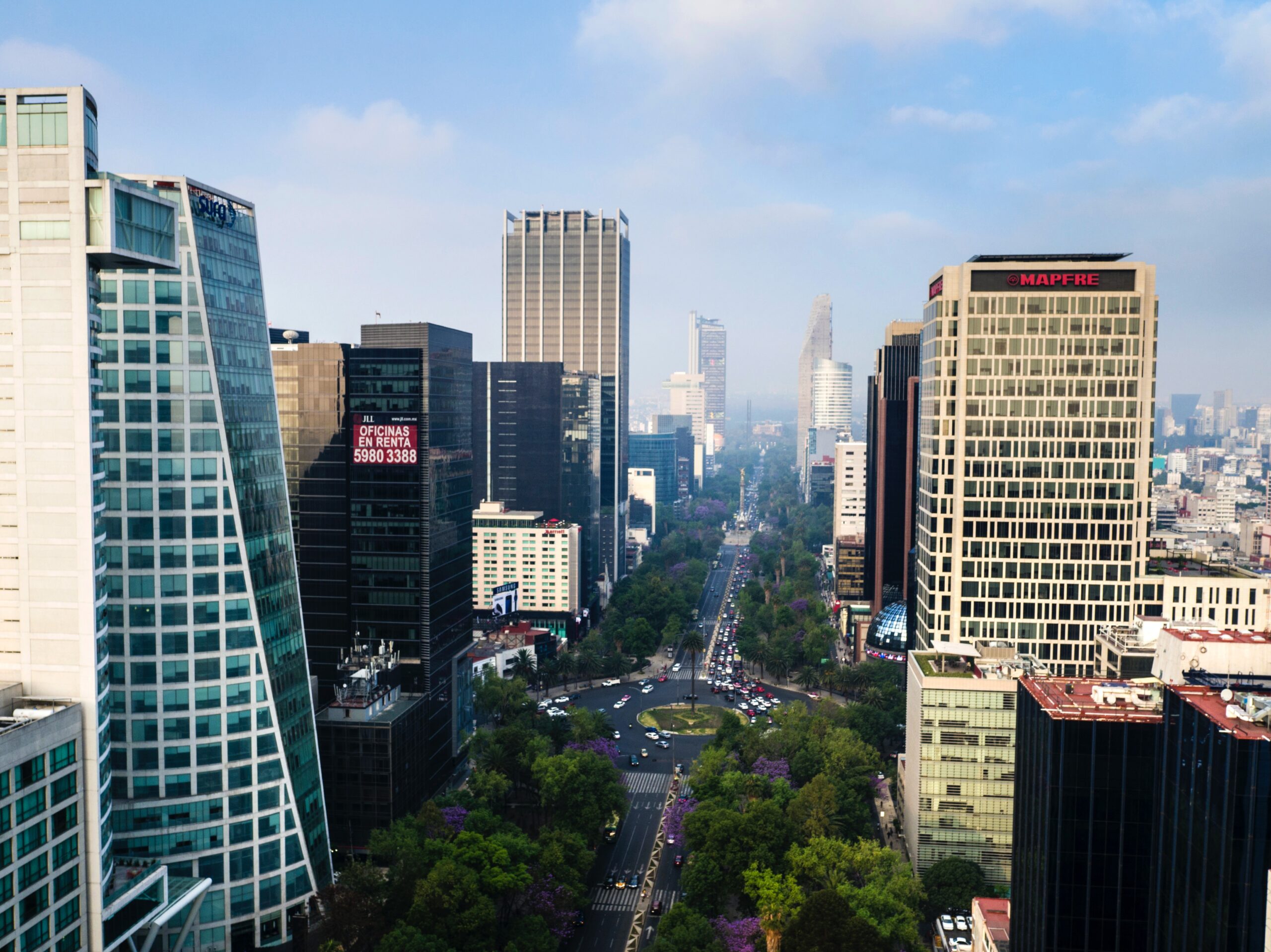 These places in Mexico City are great in terms of safety. Check out the top areas where tourists will feel safe. 
pictured: the metropolitan are of Mexico City with tall buildings and full streets