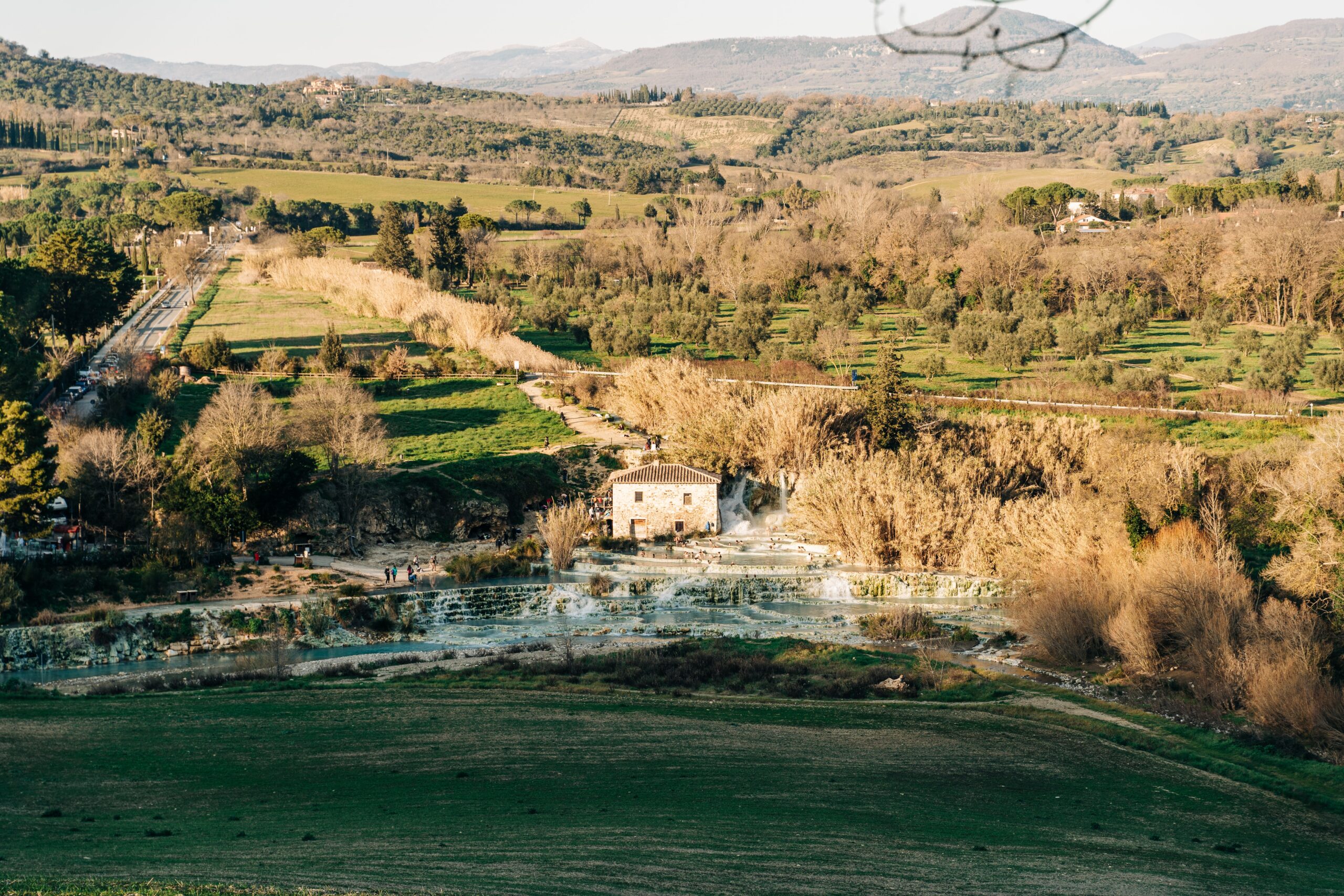 Saturnia, Italy is a hidden gem that travelers should visit. It is even enjoyable all year round.
pictured: the hills near Saturnia hot springs during the fall 
